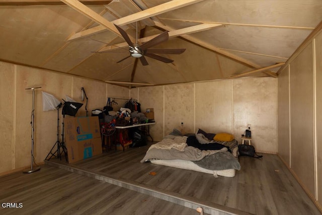 bedroom featuring hardwood / wood-style flooring, vaulted ceiling, and ceiling fan