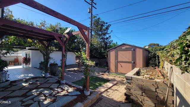 view of yard with a shed and a patio area