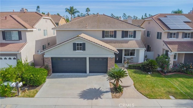 view of front of house featuring a garage and a front yard