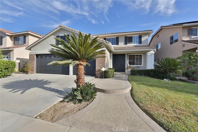 view of front facade with a front yard and a garage