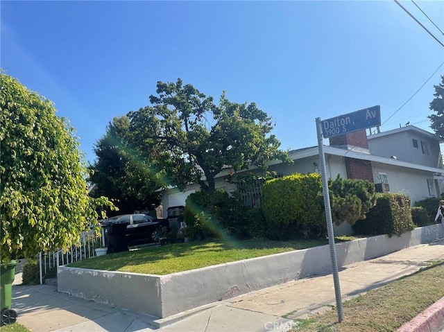 view of side of property featuring a lawn