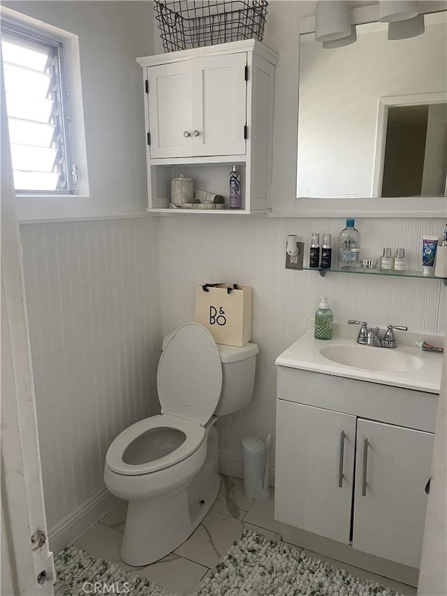 bathroom with vanity and toilet