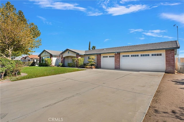 single story home featuring a front yard and a garage