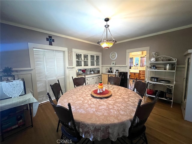 174 E Navilla Pl, Covina, CA 91723 - dining area featuring dark wood finished floors and crown molding