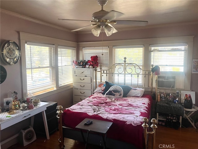 bedroom featuring multiple windows, ceiling fan, crown molding, and hardwood / wood-style flooring