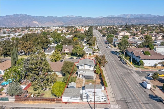 birds eye view of property featuring a mountain view