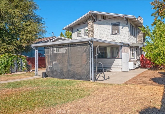 174 E Navilla Pl, Covina, CA 91723 - view of front of home featuring a patio area, a sunroom, a chimney, and cooling unit
