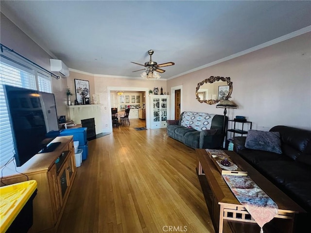 174 E Navilla Pl, Covina, CA 91723 - living area with wood finished floors, a wall unit AC, ornamental molding, and a ceiling fan
