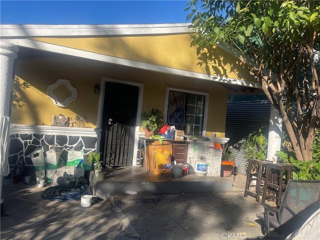 doorway to property featuring a patio