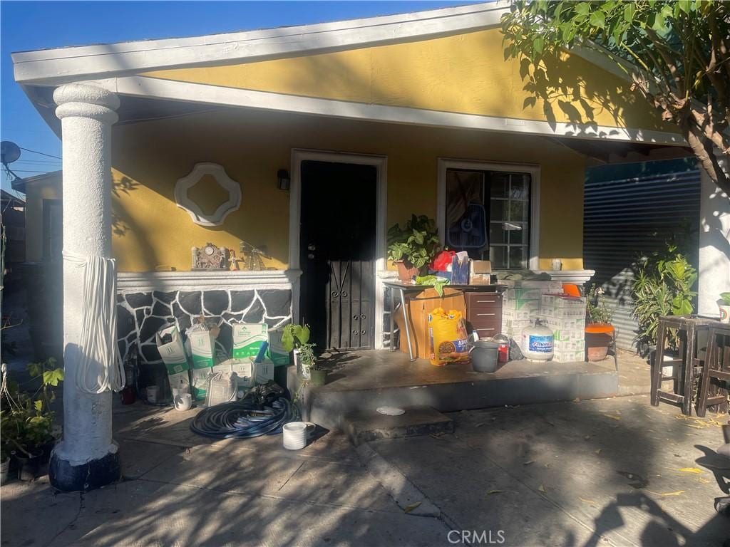 747 E 112th St, Los Angeles, CA 90059 - exterior space featuring stucco siding and a patio area
