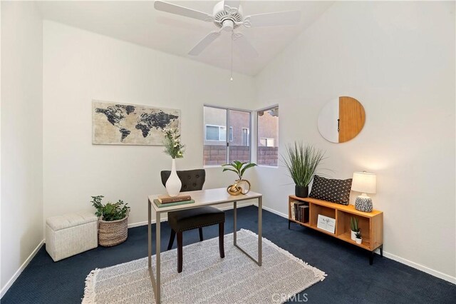 carpeted office space featuring ceiling fan and lofted ceiling