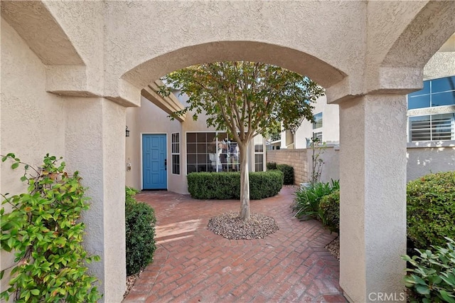 property entrance with a patio area