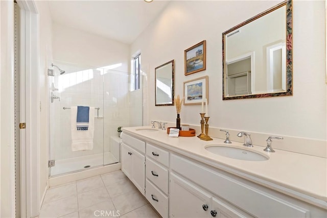 bathroom featuring tile patterned flooring, vanity, and walk in shower