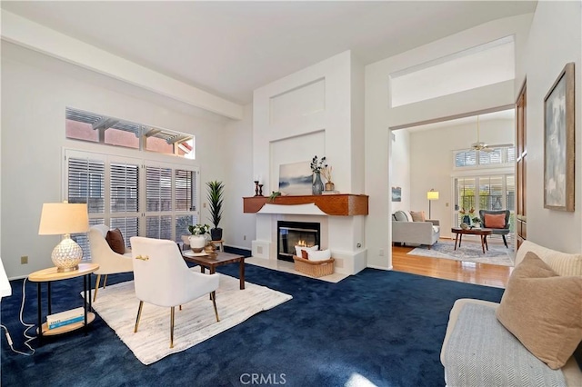 living room with hardwood / wood-style floors and ceiling fan