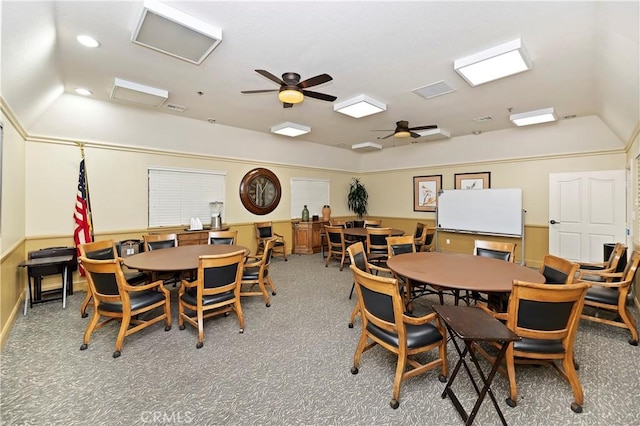 carpeted dining space featuring ceiling fan