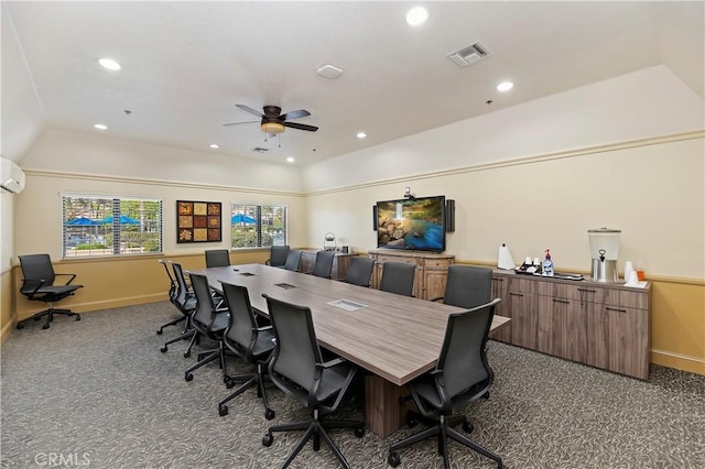 office with dark colored carpet, a wall mounted air conditioner, ceiling fan, and lofted ceiling