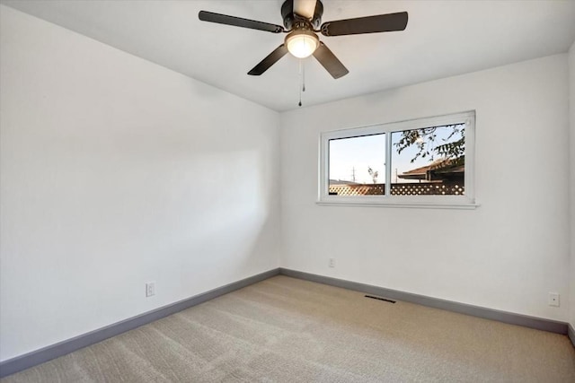 unfurnished room featuring carpet floors and ceiling fan