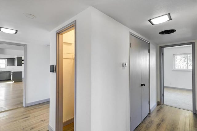 corridor featuring light wood-type flooring