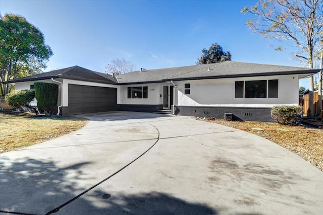 ranch-style home featuring a garage