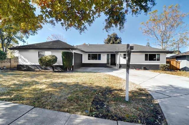 ranch-style home with a front lawn