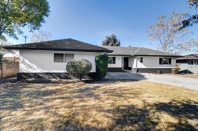 back of property with a patio and a yard