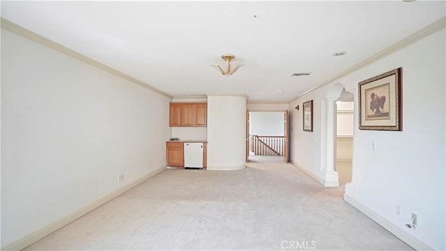 unfurnished room with light colored carpet and crown molding