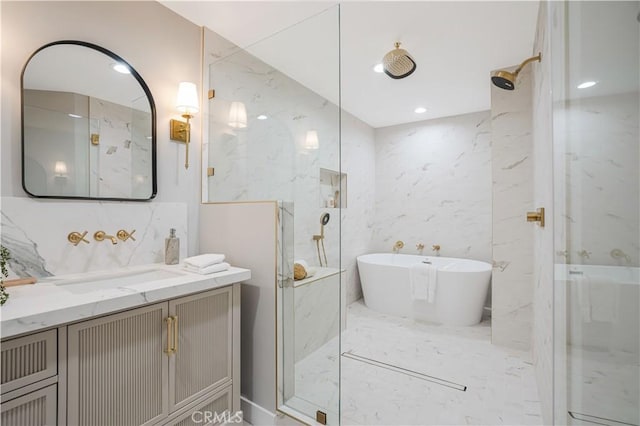 bathroom featuring vanity, tile walls, and independent shower and bath