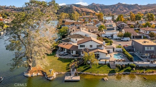 bird's eye view with a water and mountain view