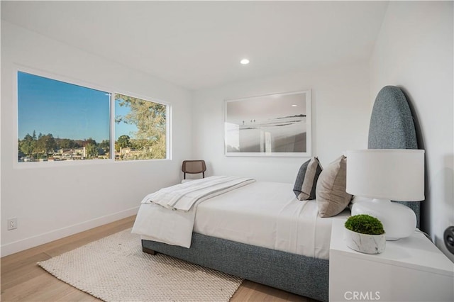 bedroom with light hardwood / wood-style floors