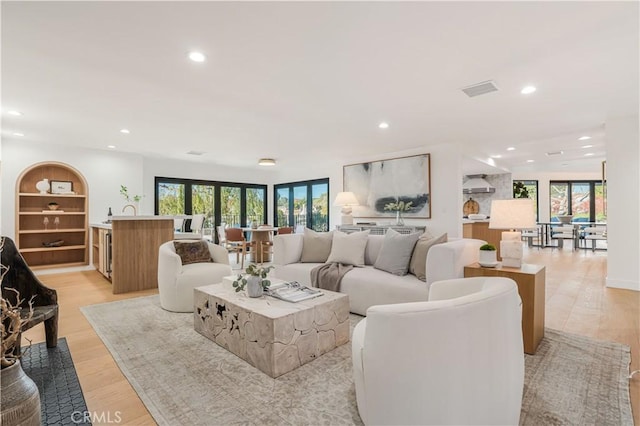 living room with light hardwood / wood-style floors