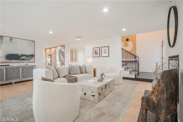 living room with light hardwood / wood-style flooring