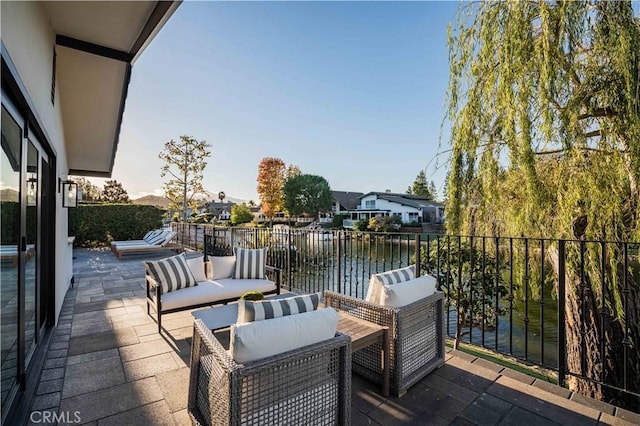 view of patio / terrace featuring a water view