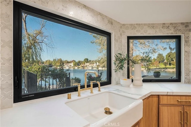 room details featuring sink and a water view