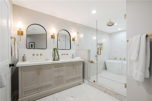 bathroom featuring vanity and shower with separate bathtub