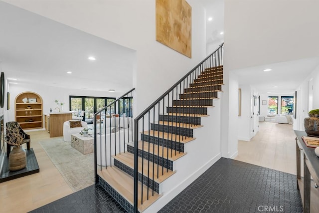 staircase featuring hardwood / wood-style floors