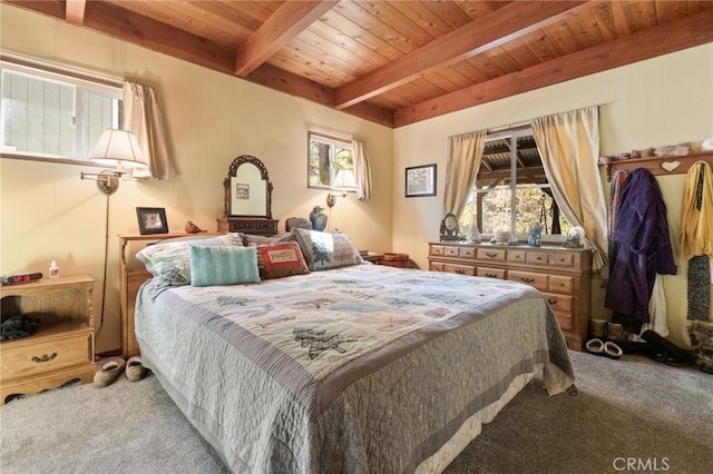 carpeted bedroom with beam ceiling, wooden ceiling, and multiple windows