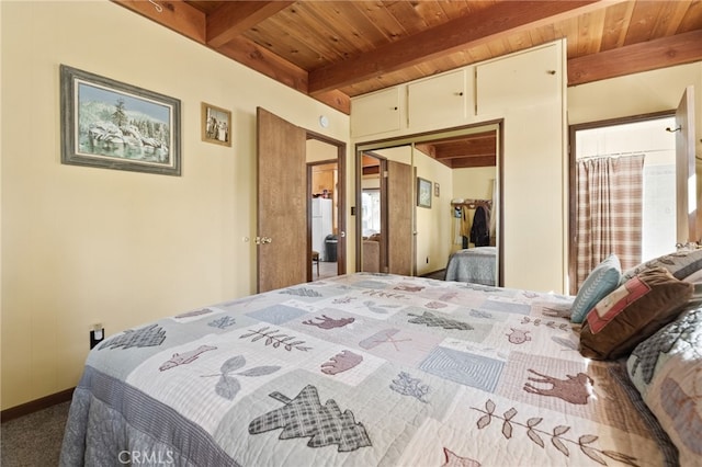 bedroom featuring a closet, beamed ceiling, and wood ceiling