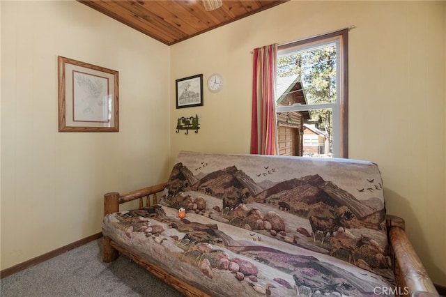 carpeted bedroom with wooden ceiling