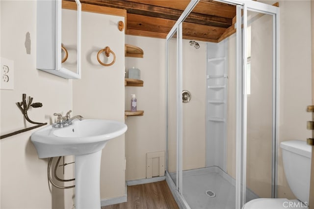 bathroom featuring walk in shower, wood ceiling, sink, hardwood / wood-style flooring, and toilet