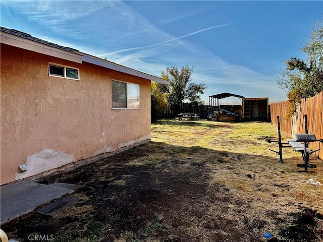 view of yard with a carport