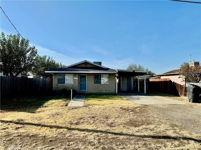 view of front of property with a carport