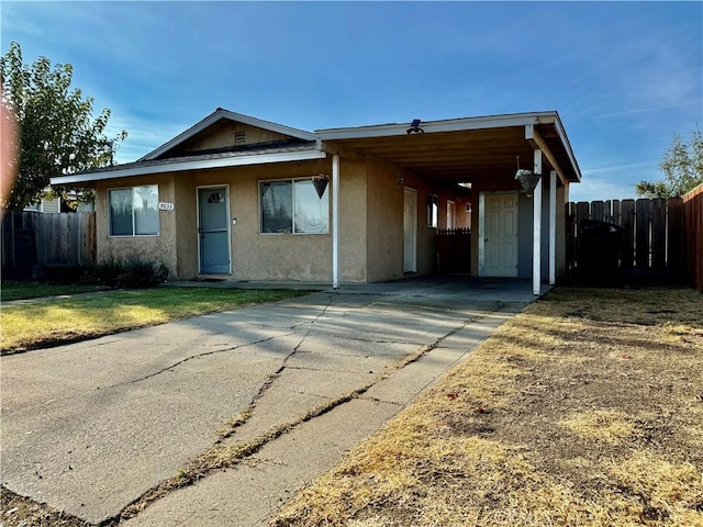 view of front of home with a carport