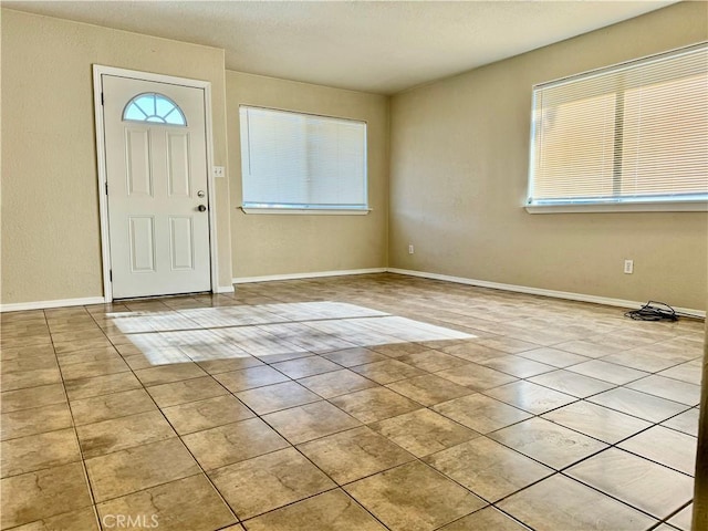 foyer with light tile patterned floors