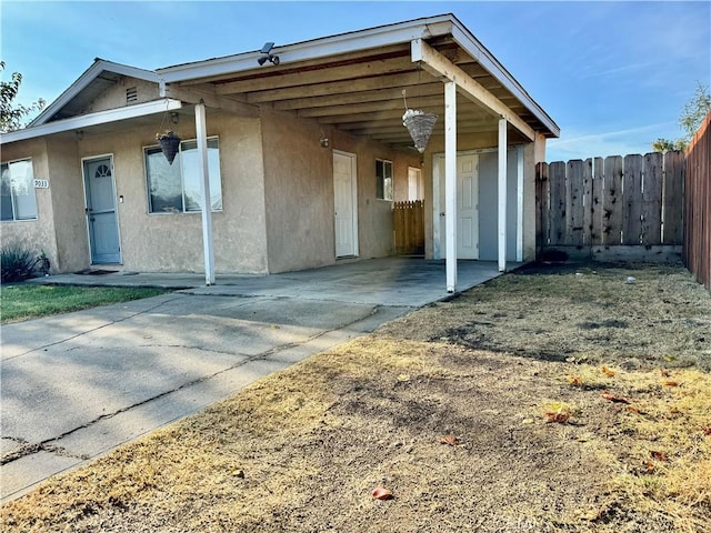 exterior space featuring a carport