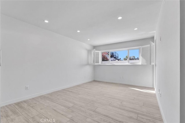 unfurnished room featuring light hardwood / wood-style floors