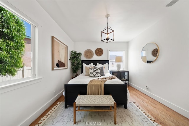 bedroom with hardwood / wood-style flooring