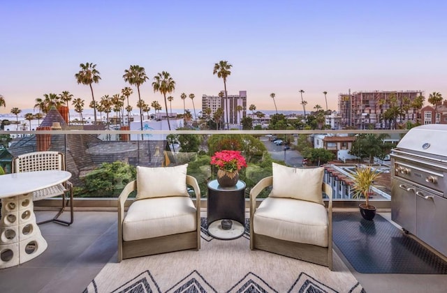 patio terrace at dusk with a balcony