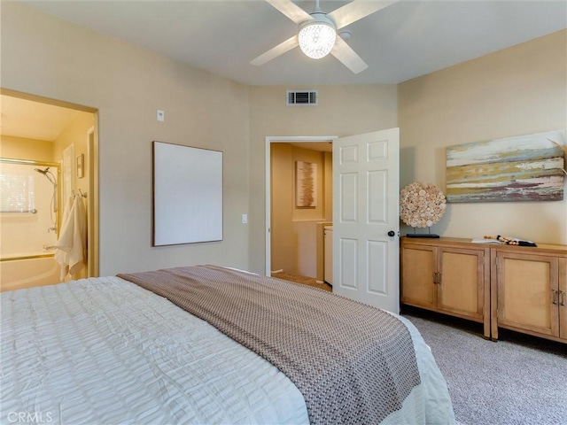 carpeted bedroom featuring ceiling fan and ensuite bathroom