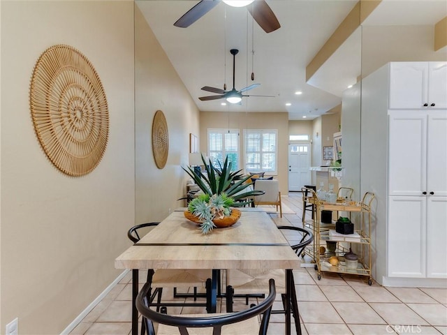 dining area with ceiling fan and light tile patterned floors