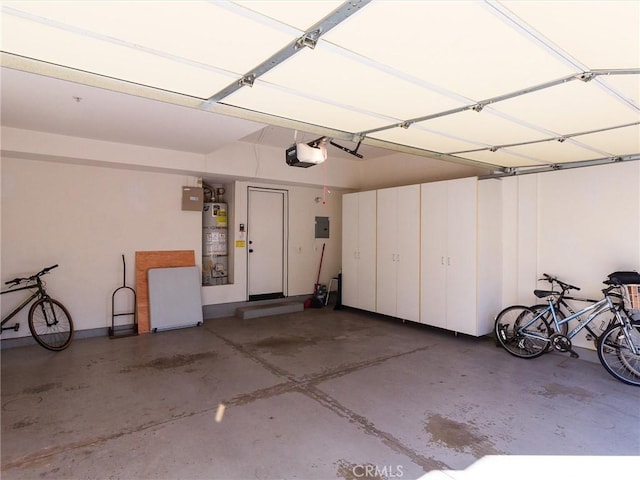 garage with a garage door opener and gas water heater